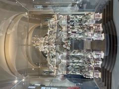 Porcelain exhibit showcasing a variety of white and delicately painted porcelain figurines and decorative items