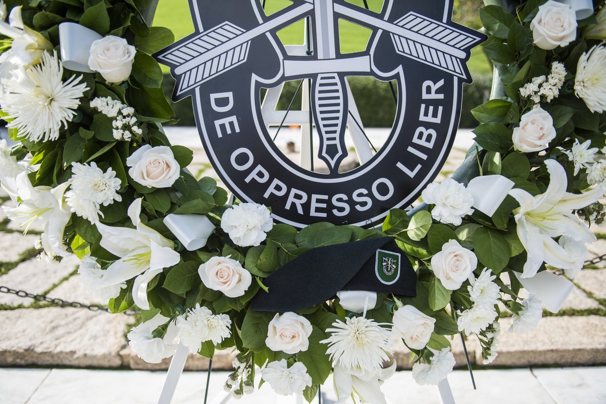 Green beret left on wreath at President John F Kennedy's gravesite during 1st Special Forces Command Wreath-Laying Ceremony at Arlington National Cemetery