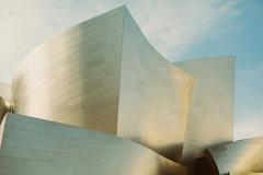 Walt Disney Concert Hall in Los Angeles, United States, with its distinctive stainless steel curved architecture under a clear sky