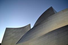 Walt Disney Concert Hall in Los Angeles during sunset with reflections on water
