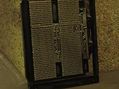 Antique printing press creating detailed embellishments