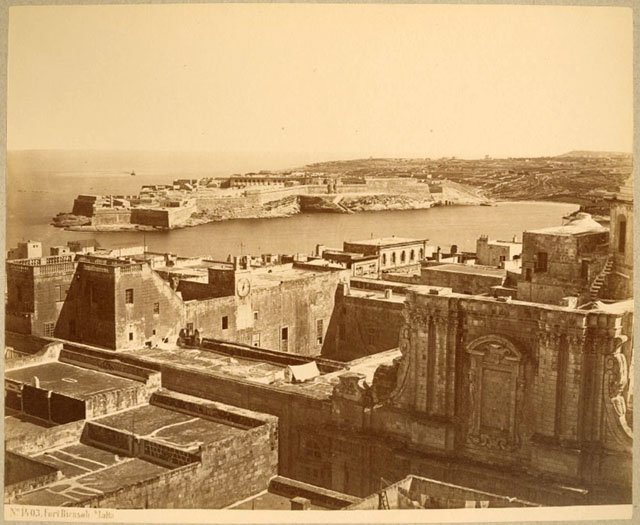 View of Fort Ricasoli in Malta with the Church of the Jesuits and Old University Building in the foreground
