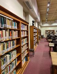 Modern library interior at University of Malta Valletta campus with bookshelves and study areas