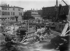 Construction site of Andrew station in April 1917 with railway tracks and workers