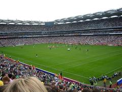 Aerial view of Croke Park sports stadium in Dublin, Ireland with full stands and green Gaelic football pitch