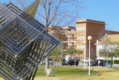 Central Plaza at University of Huelva, Carmen Campus with modern buildings and people walking