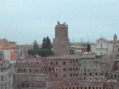 Rome cityscape featuring Torre delle Milizie and Trajan's Market with Via Nazionale and the church of SS. Domenico e Sisto in the background