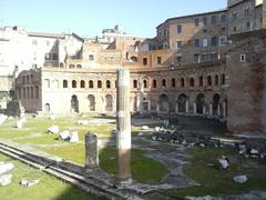 Trajan's Forum in Rome with ancient ruins and columns under blue sky