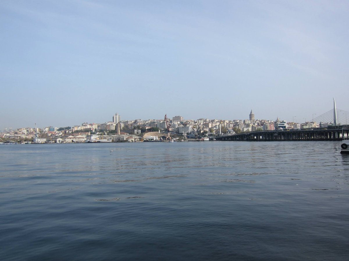 Aerial view of Istanbul cityscape with densely packed buildings and Bosphorus Bridge