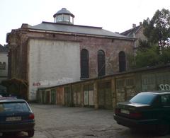 St. Anthony street number 6 in Wrocław with the White Stork Synagogue in the background