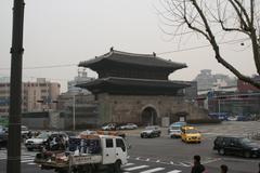 Dongdaemun Gate in Seoul with modern cityscape in background