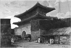 Historic Seoul Gate at sunset with traditional architecture and surrounding greenery