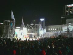 2013 Korea railroad general strike demonstration in Seoul Plaza showing large crowd with flags and banners