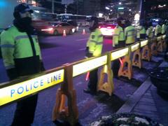 Police line during demonstration directing traffic