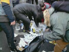 Protester cleaning street during 2013 Korean Confederation of Trade Unions General Strike