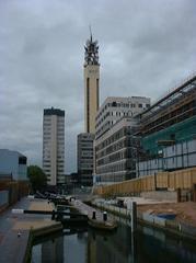 View down Farmers Bridge Locks on Birmingham and Fazeley Canal towards British Telecom Tower in Birmingham England