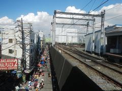 Baclaran Shopping Mall and Baclaran Terminal Plaza flea market along Taft Avenue Extension in Pasay City near LRT Baclaran Station, featuring bustling street-flea market scenes under bright daytime