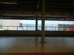 Platform at Baclaran LRT Station in Manila with yellow safety lines and staircases