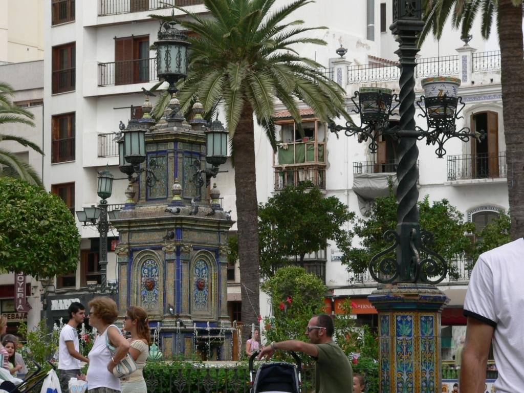 Central square in Algeciras with palm trees and historic buildings