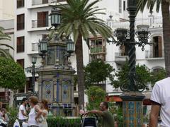 Central square in Algeciras with palm trees and historic buildings