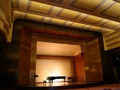Interior view of Barber Institute of Fine Arts concert hall with rows of seating and stage