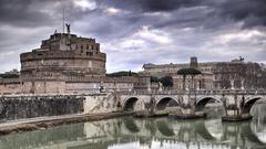 Castel Sant'Angelo and Sant'Angelo Bridge in Rome at sunset