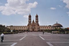 Basilica of Zapopan with Las Americas Plaza in downtown Zapopan under a clear blue sky