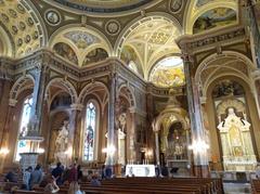 Interior view of the Basilica of St. Josaphat in Milwaukee with ornate architectural details and colorful stained glass windows