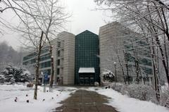 Exterior view of the KMU library building with clear blue sky