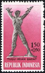 1963 Indonesian stamp depicting construction of West Irian Monument