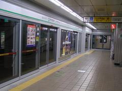 Euljiro 1-ga Station entrance with directional sign and escalator