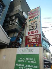 Jupiter Street in Bel-Air Village, Makati City with visible signs of Papa John's Pizza and Burger King