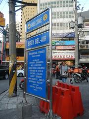 Street view of Jupiter Street in Bel-Air Village, Makati City with traffic and commercial establishments including Papa John's Pizza and Burger King