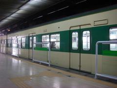 Hanyang University Subway Station platform with people waiting and trains
