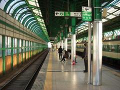 Seongsu Station exterior with modern glass architecture and people walking outside