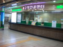 Samseong Station entrance with modern design and people walking