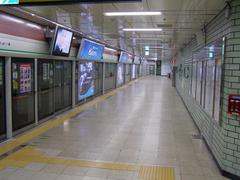 Yeoksam station interior with escalators and people walking