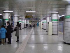 Entrance of Yeoksam subway station with escalators and numbered signs