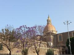 View of ex Monastero dei Benedettini in Catania with historical architecture under blue sky