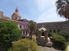 Facade of the former Benedictine Monastery in Catania with blue sky