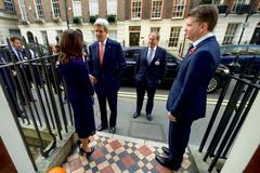 U.S. Secretary of State John Kerry speaking with Dr. Marcia Balisciano at the Benjamin Franklin House in London