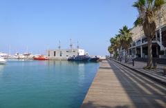 Marina of Alicante with boats and yachts under a clear blue sky