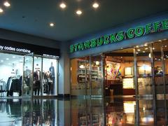 Exterior view of Coex Mall in Seoul with modern architectural design and busy pedestrian walkway