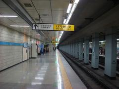 Suyu Station platform on Seoul Subway Line 4 with trains and passengers