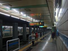 Mia Station railway tracks and platforms with passengers