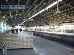 Seongnae Station platform with train tracks and overhead electrical lines