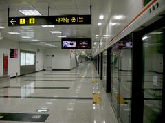 Platform of Garak Market Station on Seoul Metro Line 3 with waiting area and signage