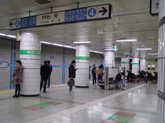 Sadang Station platform with tracks and passengers