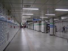 Sadang station entrance with people and signage