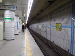 Sadang Station subway platform with trains and passengers